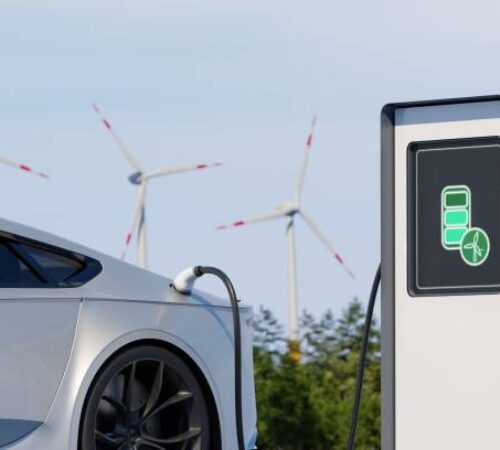 Car charging electric power with a background of solar panel energy